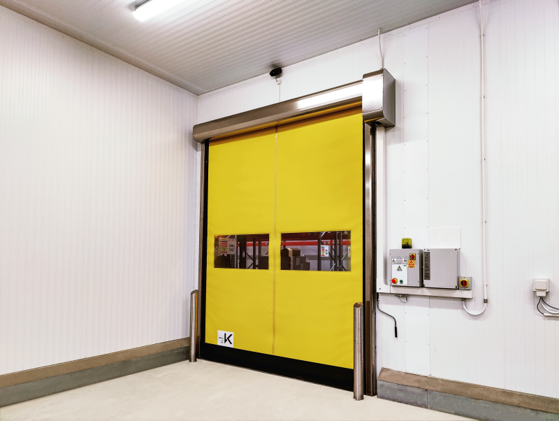 Yellow high speed door installed in a clean food factory.