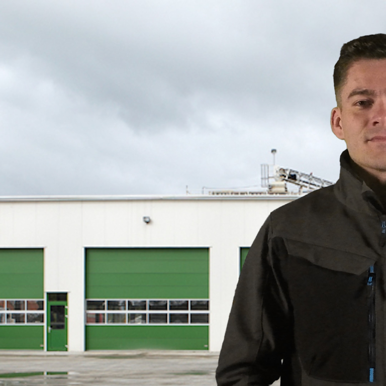 Tile image of presenter standing in front of industrial building. Ready to discuss the 3 main way to eliminate water ingress through external doors. Click the link to learn more.