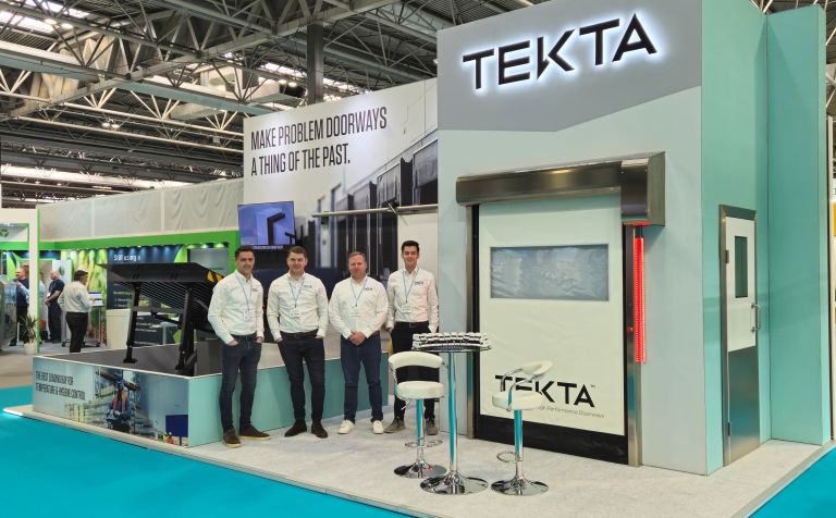Team standing in front of exhibition stand at FoodEx 2025 show