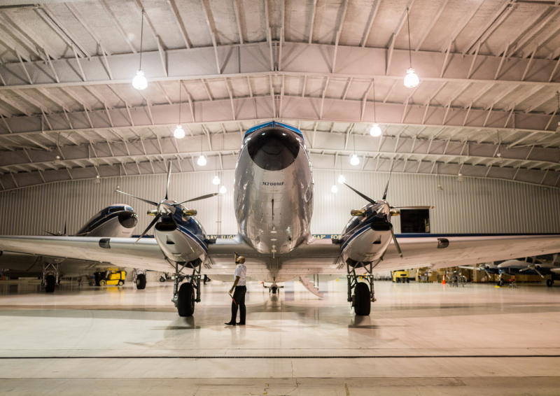 Silver aircraft in aircraft hanger